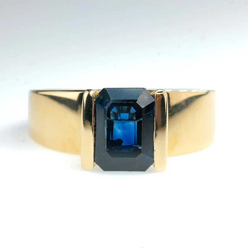 1.95ct Bar-Set Emerald Cut Blue Sapphire Solitaire Ring in 14K Yellow Gold